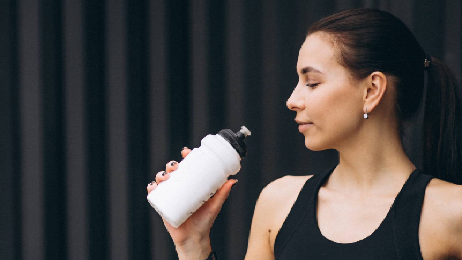 A woman drinking protein shake