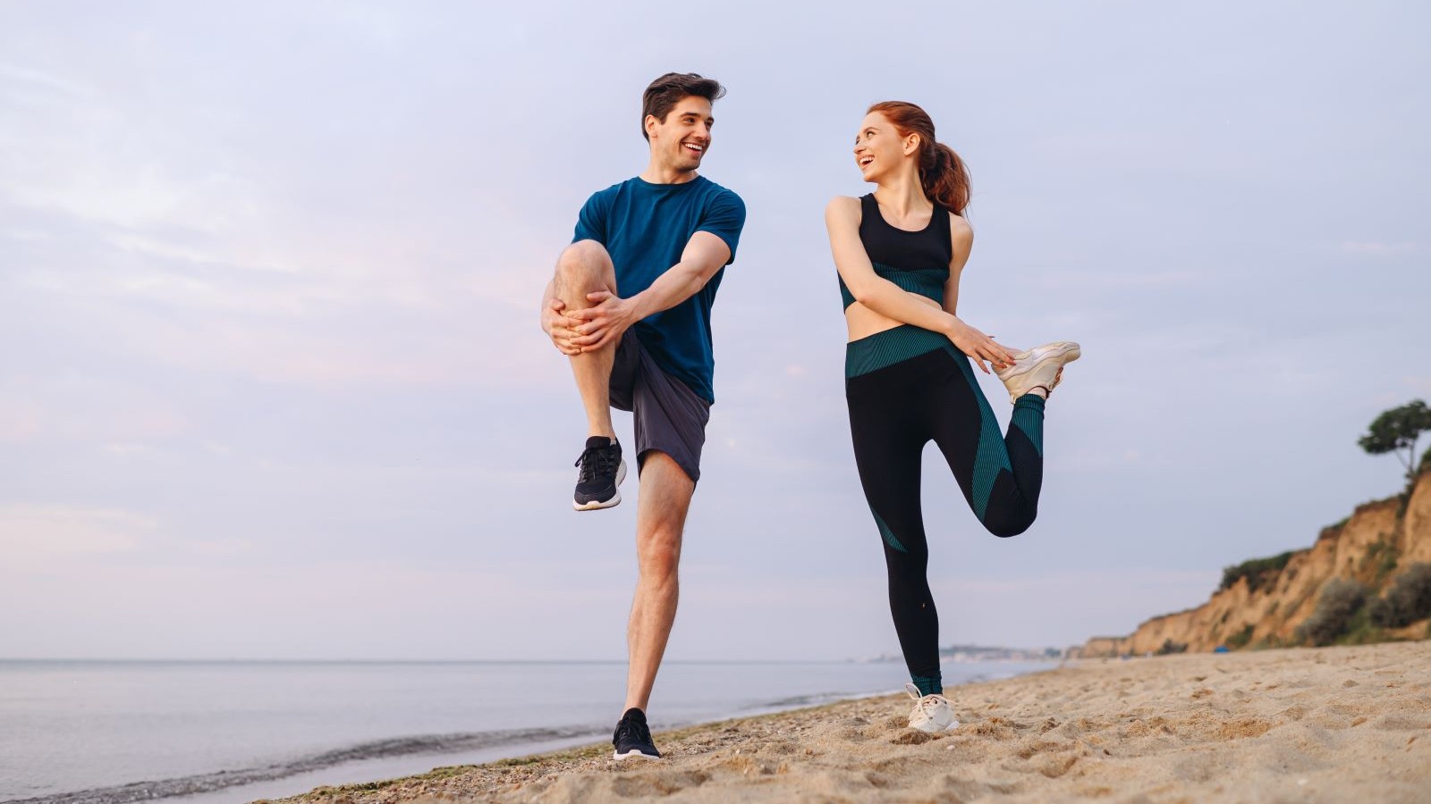 Couple doing stretching exercise